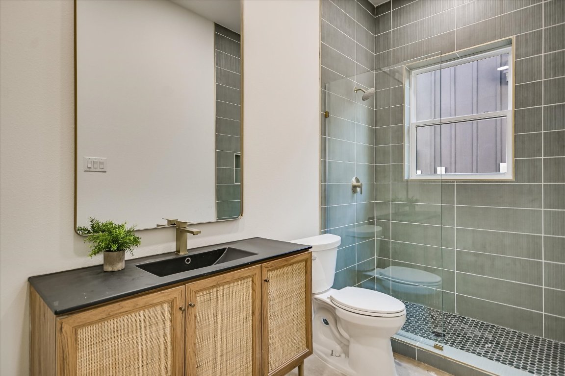 54 War Bonnet Wimberley, TX 78676 - Photo 21 of 32 a bathroom with a sink toilet and shower