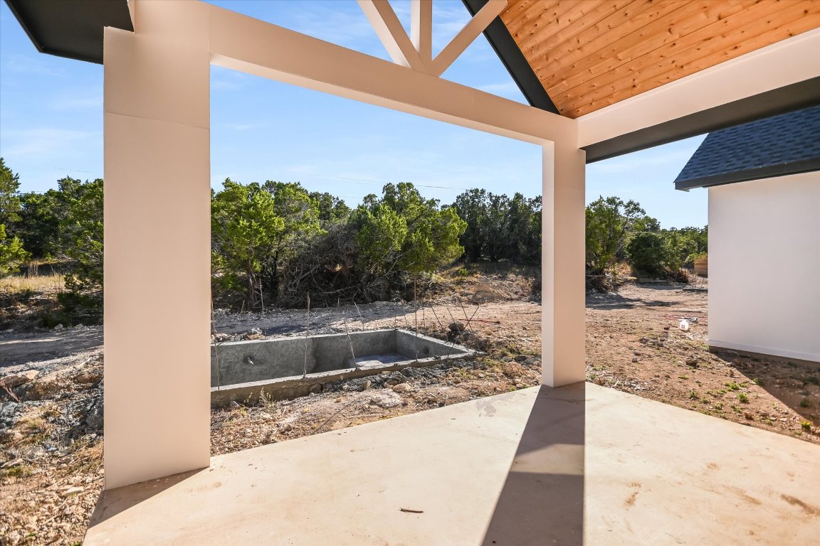 54 War Bonnet Wimberley, TX 78676 - Photo 25 of 32 a view of a living room and a floor to ceiling window
