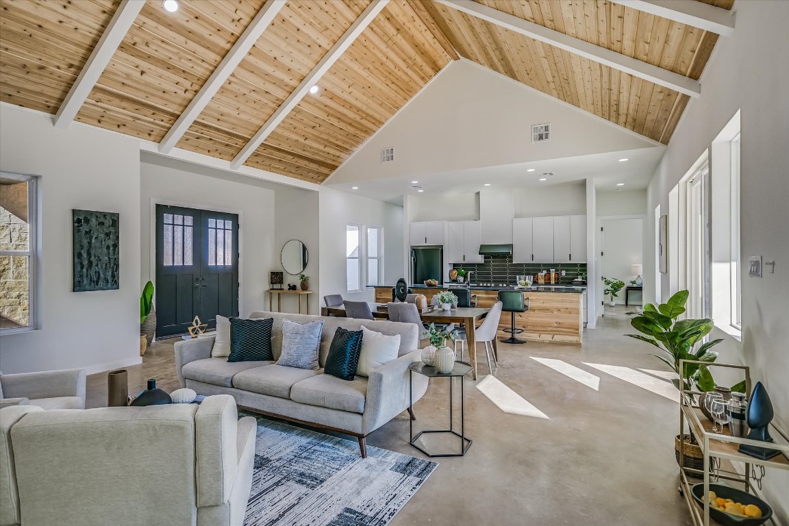 54 War Bonnet Wimberley, TX 78676 - Photo 6 of 32 a living room with furniture kitchen view and a chandelier