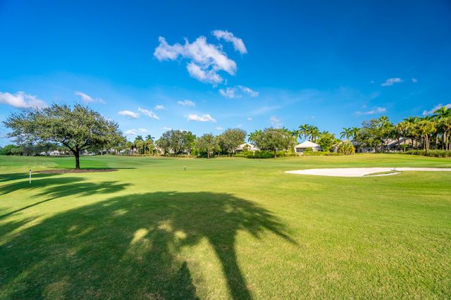 a view of a golf course with a lake view