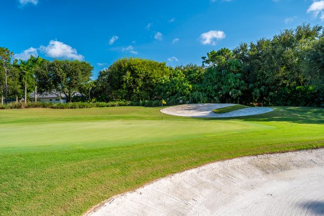 a view of a big yard with a fountain