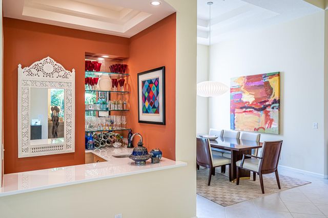 a dining room with furniture and a window