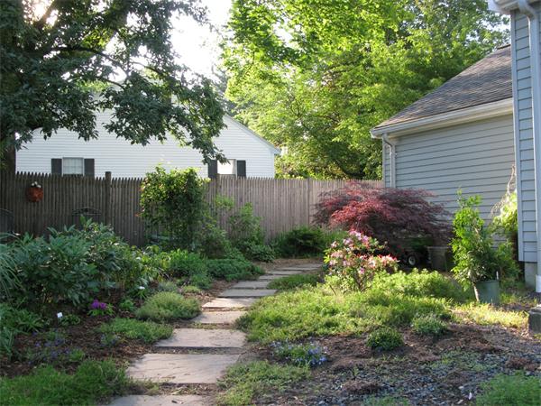5 Garrison Road Wellesley, MA 02482 - Photo 18 of 19 a view of a house with a yard and plants