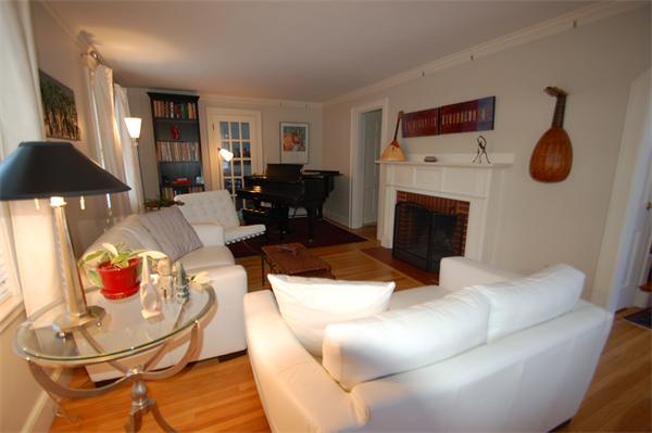 5 Garrison Road Wellesley, MA 02482 - Photo 2 of 19 a living room with furniture and a fireplace