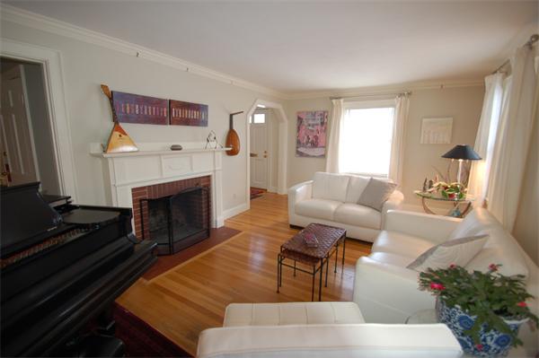 5 Garrison Road Wellesley, MA 02482 - Photo 3 of 19 a living room with furniture and a fireplace