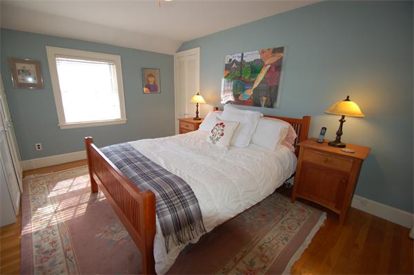 5 Garrison Road Wellesley, MA 02482 - Photo 10 of 19 a bedroom with a bed and painting on the wall