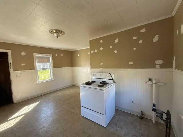 a kitchen with a stove and a refrigerator