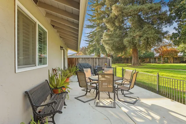 a view of a chairs and table in the patio
