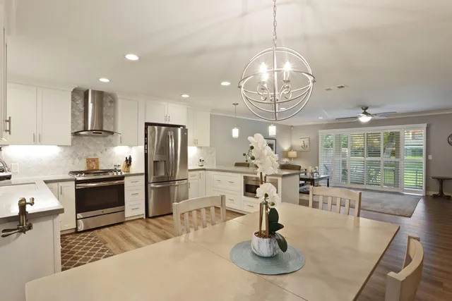 a kitchen with counter top space cabinets and appliances