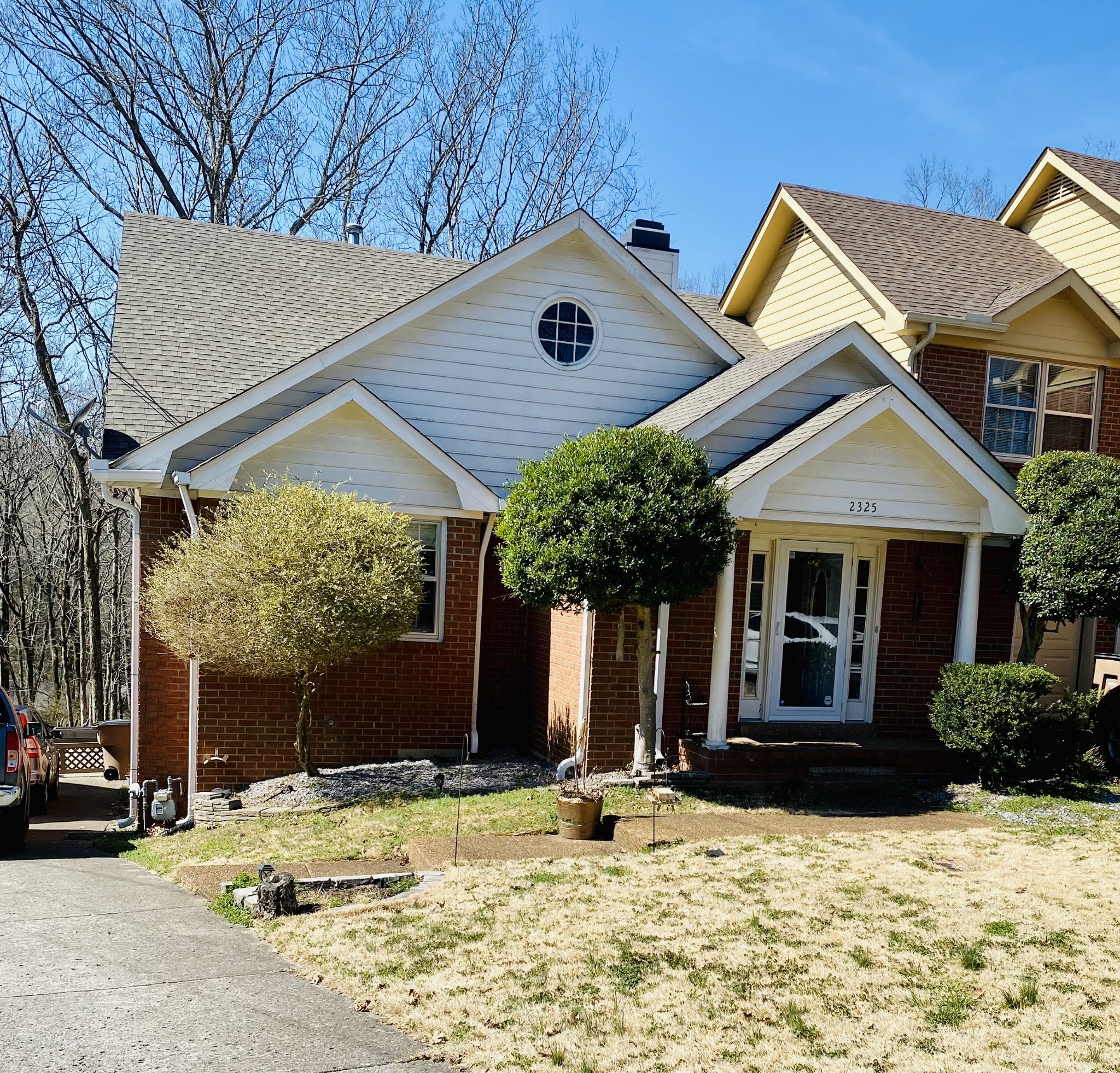 a front view of a house with a yard