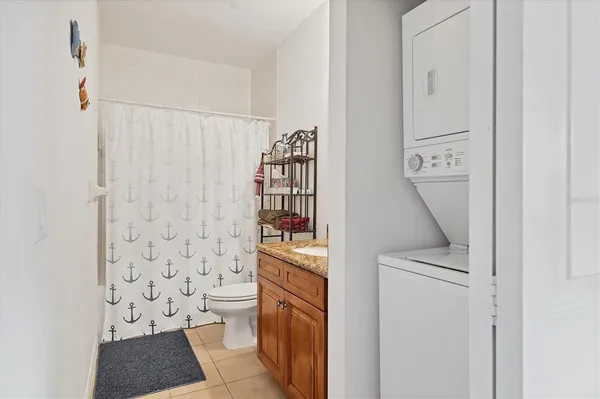 a view of a balcony with a table and chairs