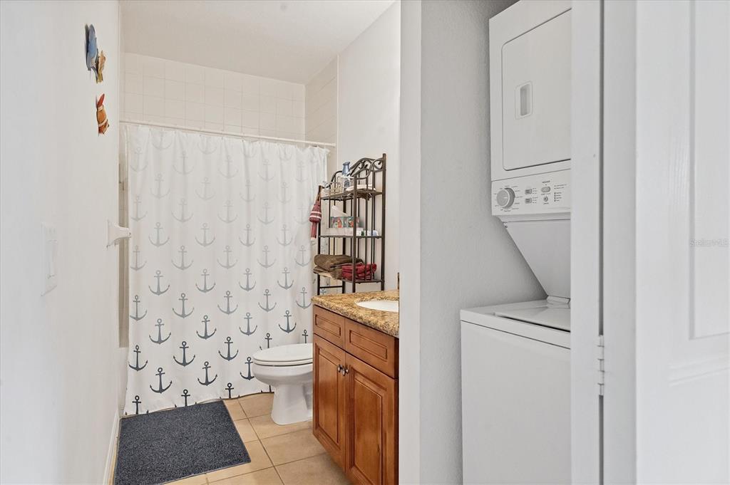 8411 Placida Road, Unit 404 Placida, FL 33946 - Photo 27 of 54 a bathroom with a toilet a sink and a shower