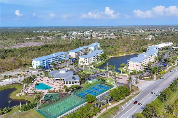 a view of swimming pool with a table and chairs