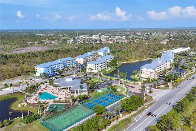 a view of swimming pool with a table and chairs