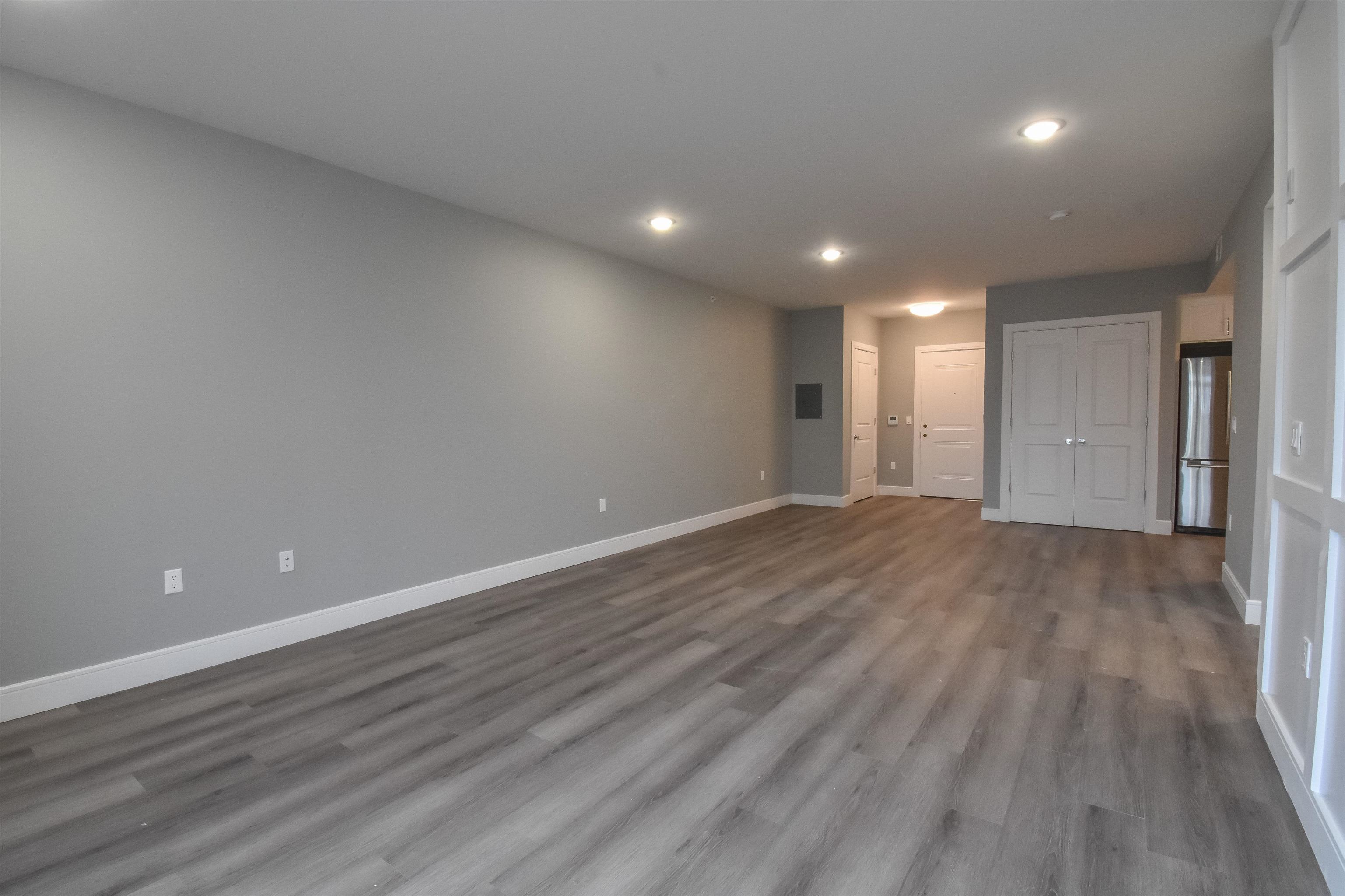 4201 Bergen Turnpike, Unit 2D North Bergen, NJ 07047 - Photo 3 of 12 an empty room with wooden floor and windows