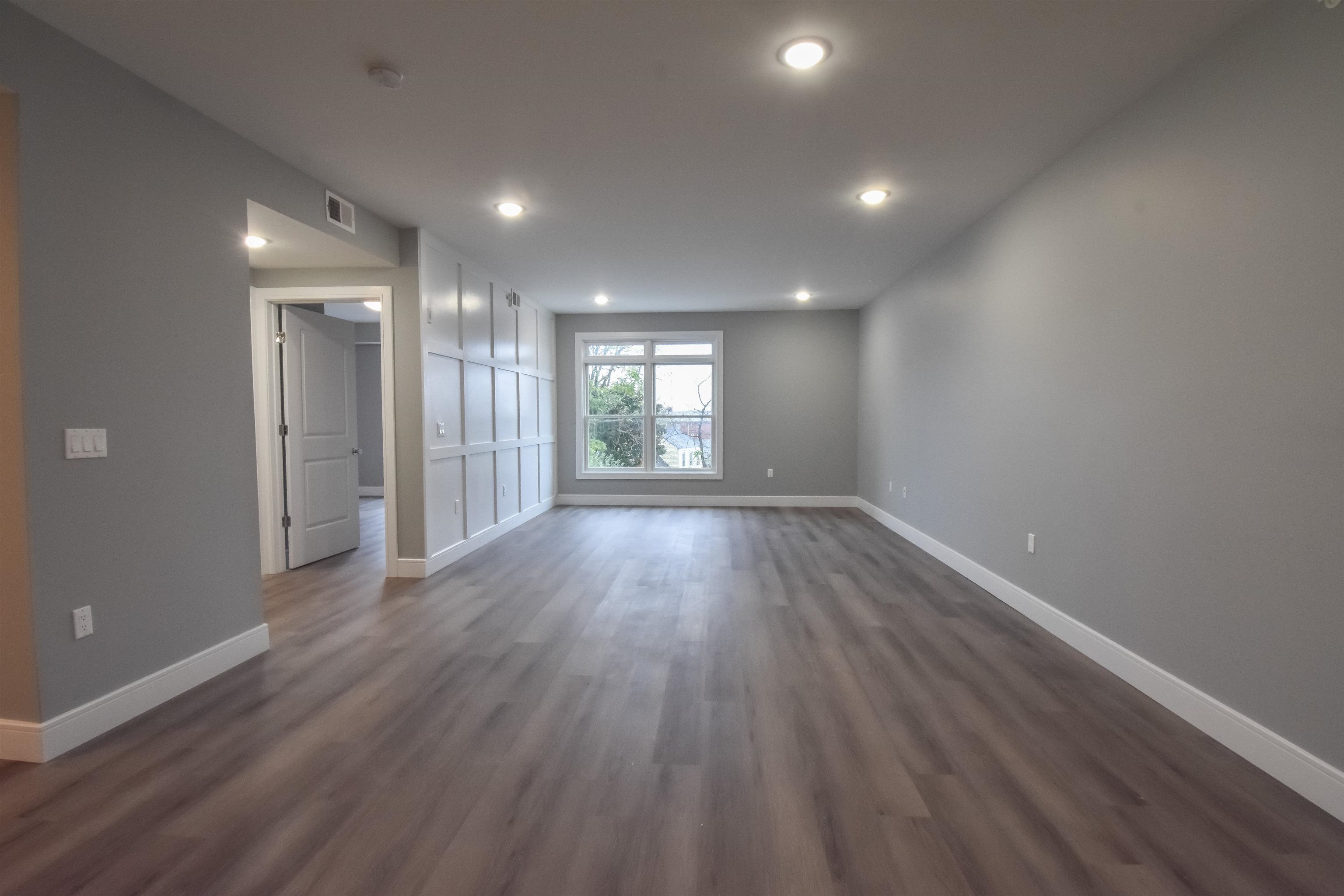 4201 Bergen Turnpike, Unit 2D North Bergen, NJ 07047 - Photo 6 of 12 wooden floor in an empty room with a window