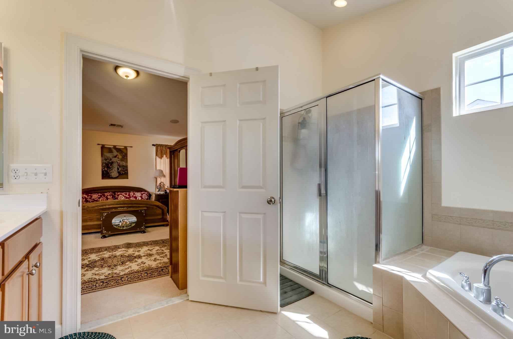 1230 Stallion Street Ranson, WV 25438 - Photo 25 of 30 a bathroom with a tub and shower