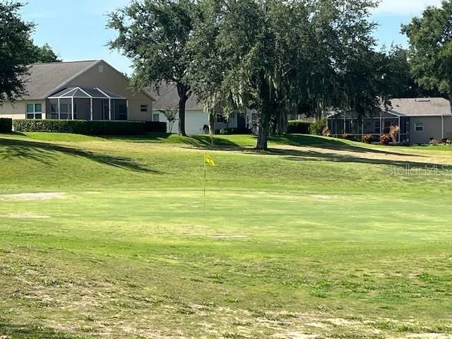 a view of a house with backyard