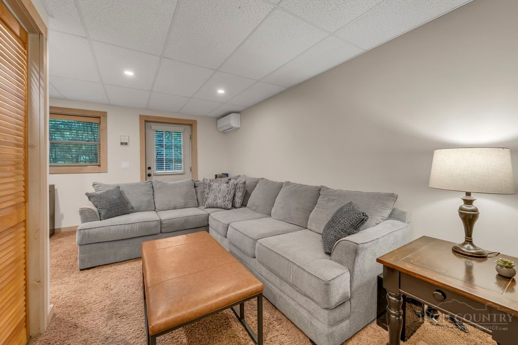 192 Dewitt Barnett Road Vilas, NC 28692 - Photo 26 of 32 a living room with furniture and a lamp