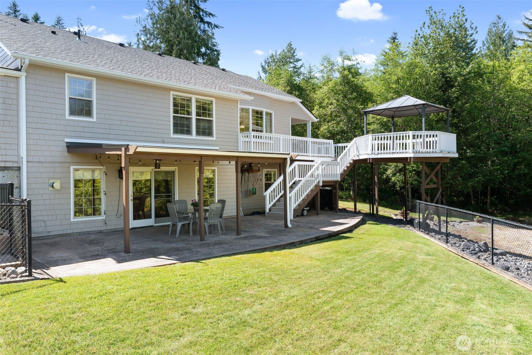 308 Brockway Road Chehalis, WA 98532 - Photo 35 of 40 a view of a house with a patio and a yard