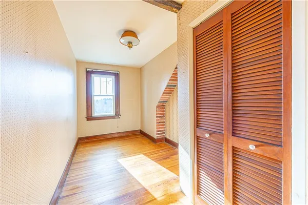 a view of a hallway with windows