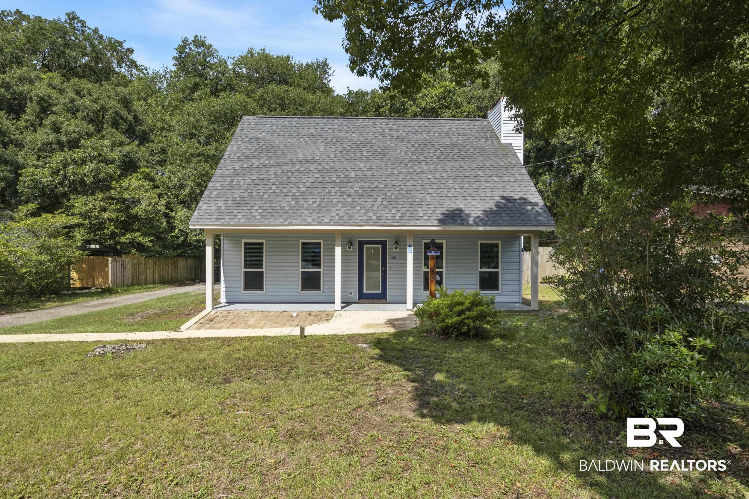 150 Montclair Loop Daphne, AL 36526 - Photo 2 of 29 Cape cod-style house featuring a front yard and a porch