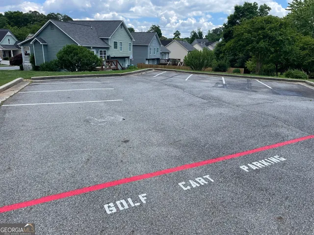a view of a house with a small yard and plants