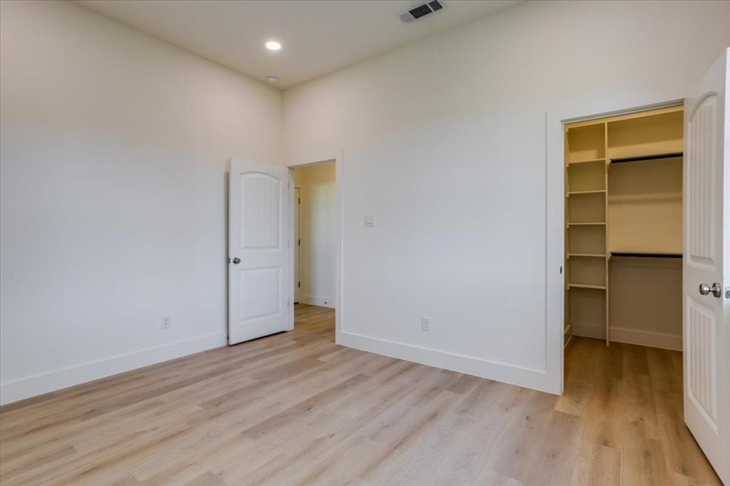 1507 Elk Creek Road Dallas, TX 75253 - Photo 26 of 40 a view of an empty room with closet and a window