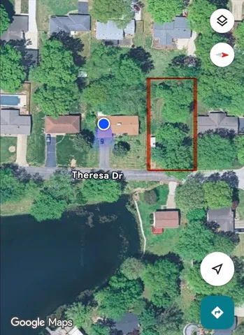 an aerial view of a swimming pool a yard and mountain view in back