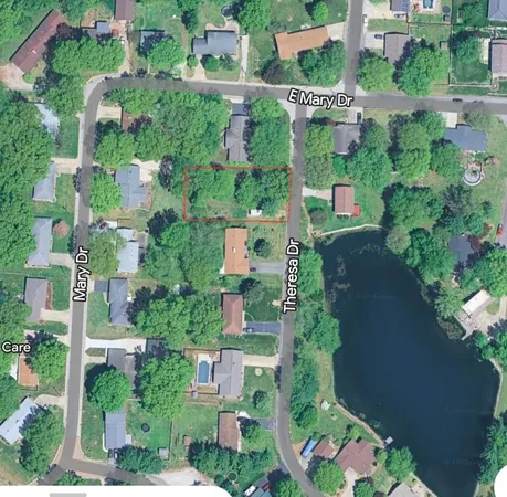 an aerial view of houses with yard