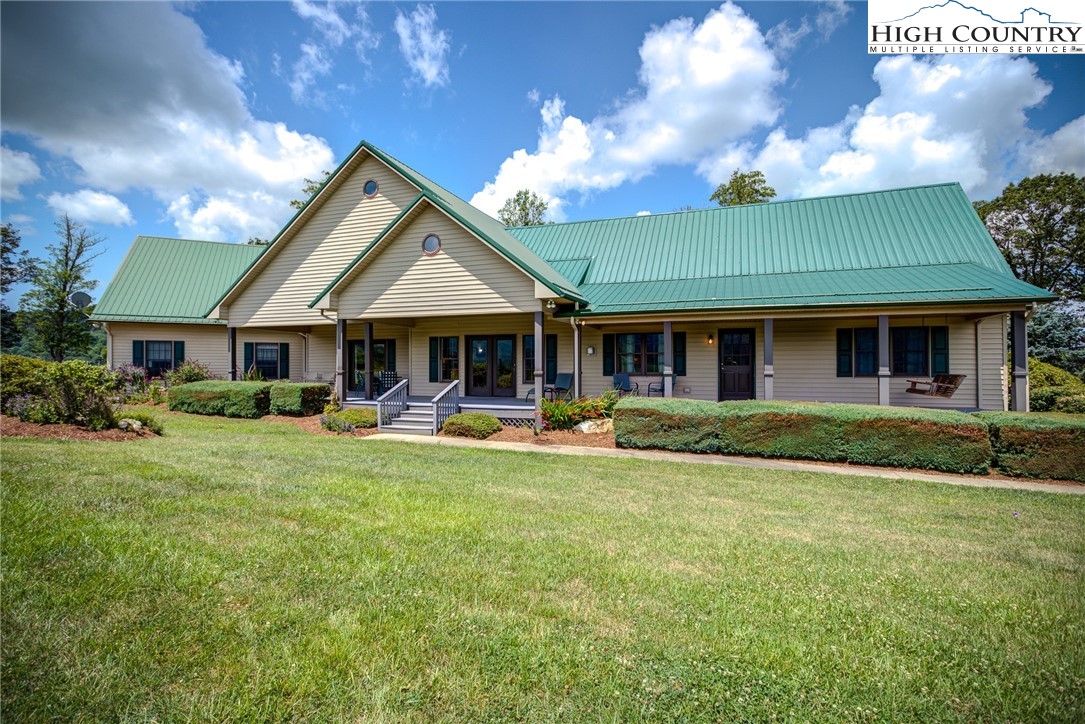 356 Irwin Farm Lane Sparta, NC 28675 - Photo 1 of 50 a front view of a house with swimming pool having outdoor seating