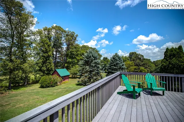 a view of balcony with wooden floor