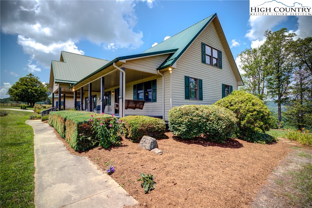 356 Irwin Farm Lane Sparta, NC 28675 - Photo 19 of 50 a front view of a house with a yard