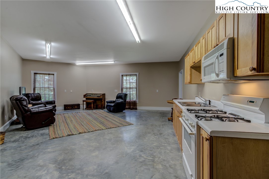 356 Irwin Farm Lane Sparta, NC 28675 - Photo 36 of 50 a view of living room with furniture and stove