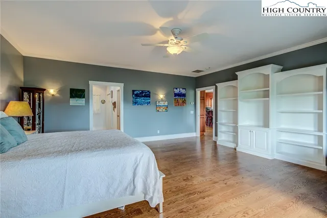 a spacious bedroom with a large bed and closet