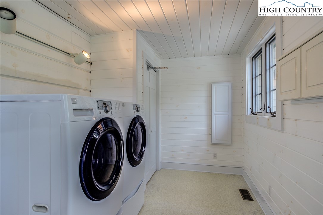 356 Irwin Farm Lane Sparta, NC 28675 - Photo 48 of 50 a utility room with dryer and washer