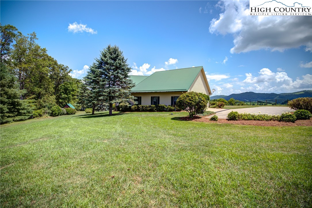 356 Irwin Farm Lane Sparta, NC 28675 - Photo 5 of 50 a front view of a house with a yard