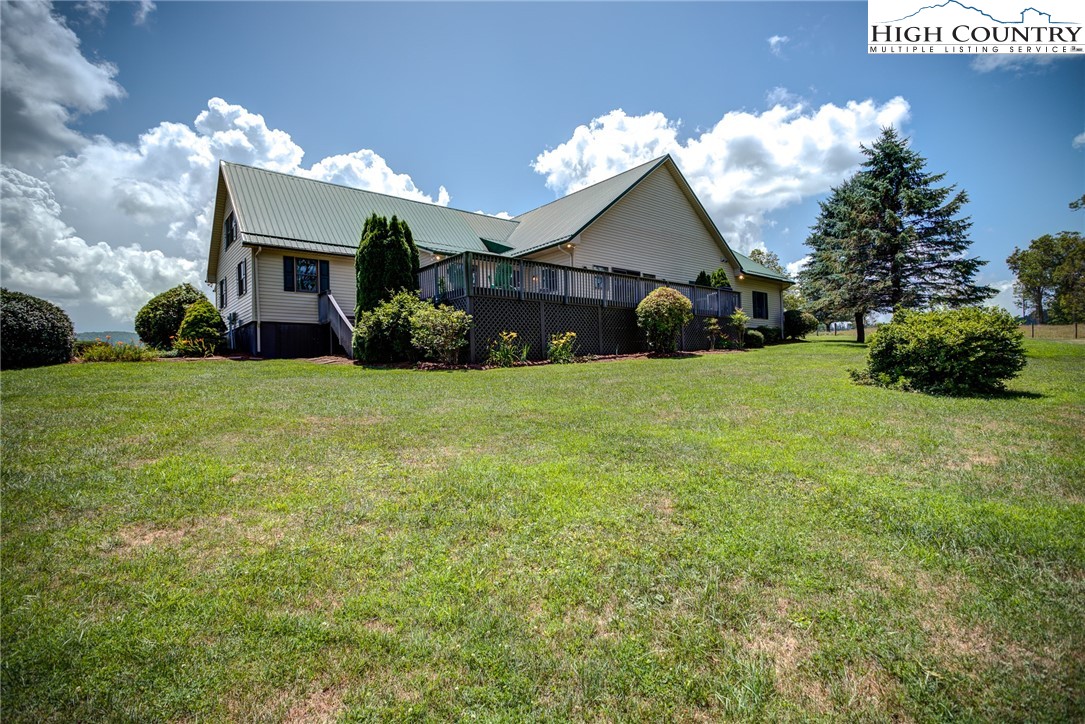 356 Irwin Farm Lane Sparta, NC 28675 - Photo 9 of 50 a front view of a house with a yard and garage