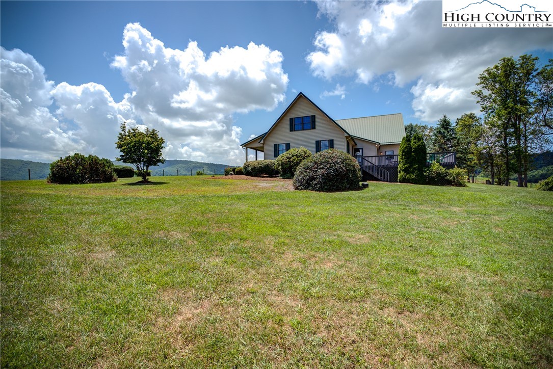 356 Irwin Farm Lane Sparta, NC 28675 - Photo 10 of 50 a front view of a house with yard and green space