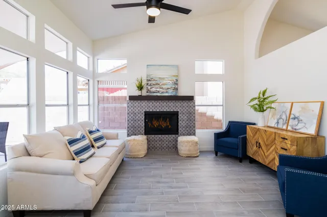 a living room with furniture and a fireplace