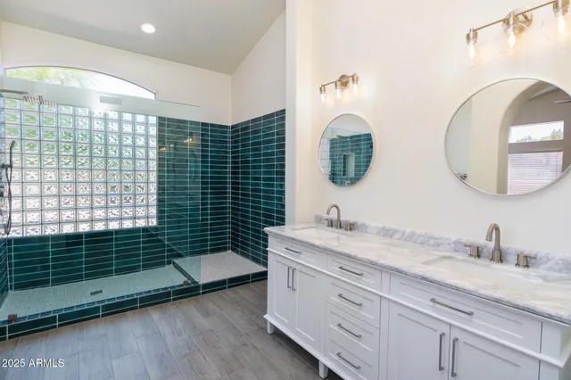 a bathroom with a double vanity sink mirror and double