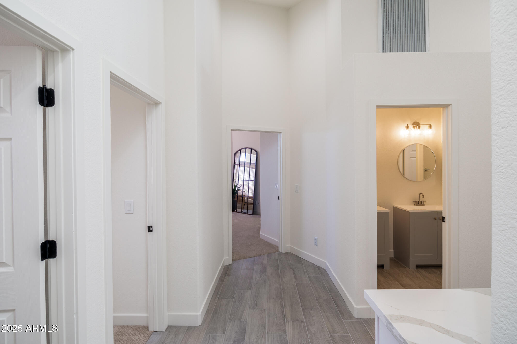 850 North Los Altos Drive Chandler, AZ 85224 - Photo 29 of 34 a view of a hallway with wooden floor and closet area