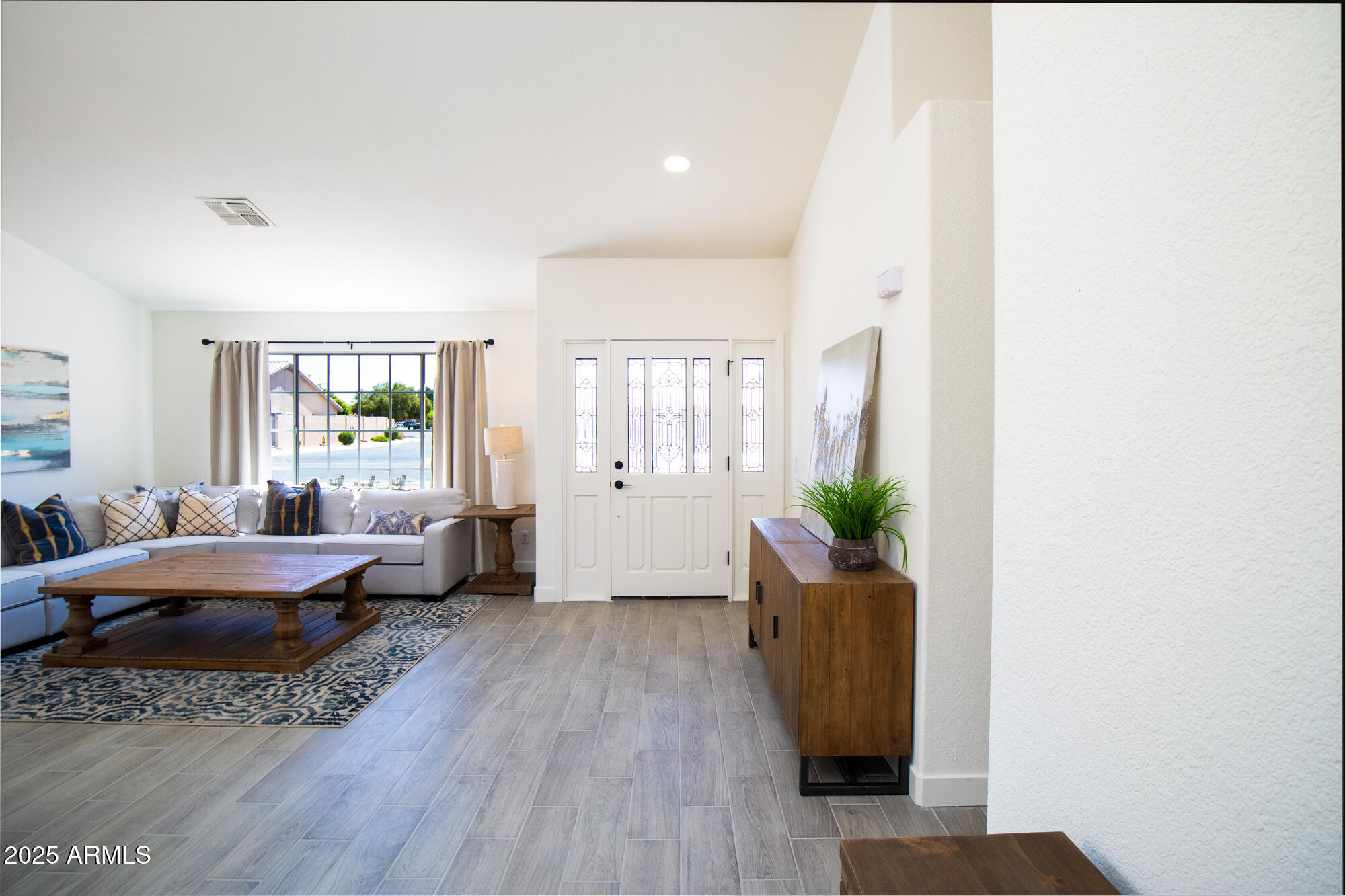 850 North Los Altos Drive Chandler, AZ 85224 - Photo 4 of 34 a living room with furniture and wooden floor