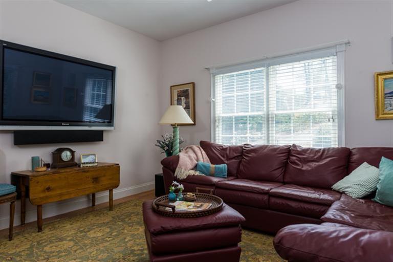 113 James Circle Mashpee, MA 02649 - Photo 13 of 21 a living room with furniture and a flat screen tv