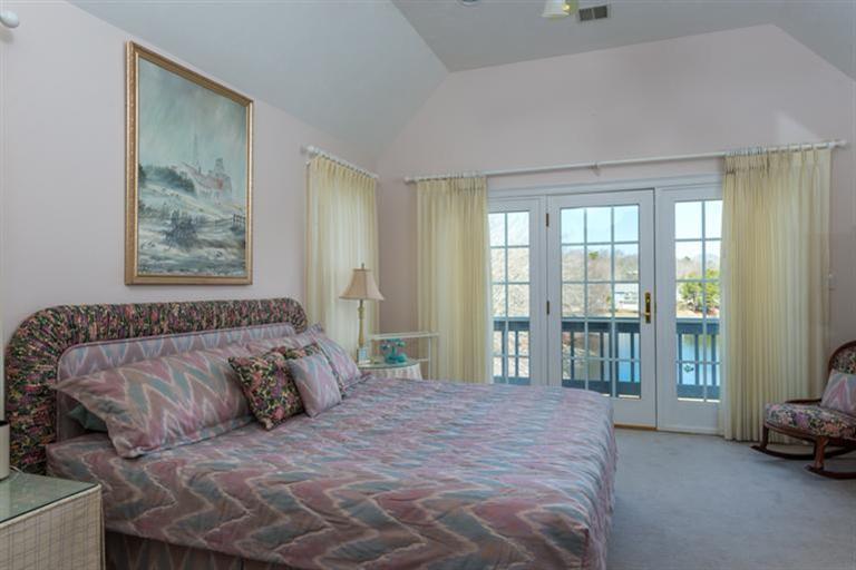 113 James Circle Mashpee, MA 02649 - Photo 15 of 21 a bedroom with a bed and a couch