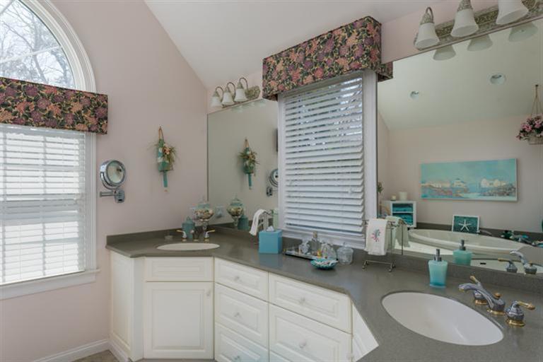 113 James Circle Mashpee, MA 02649 - Photo 17 of 21 a bathroom with a granite countertop sink and a mirror