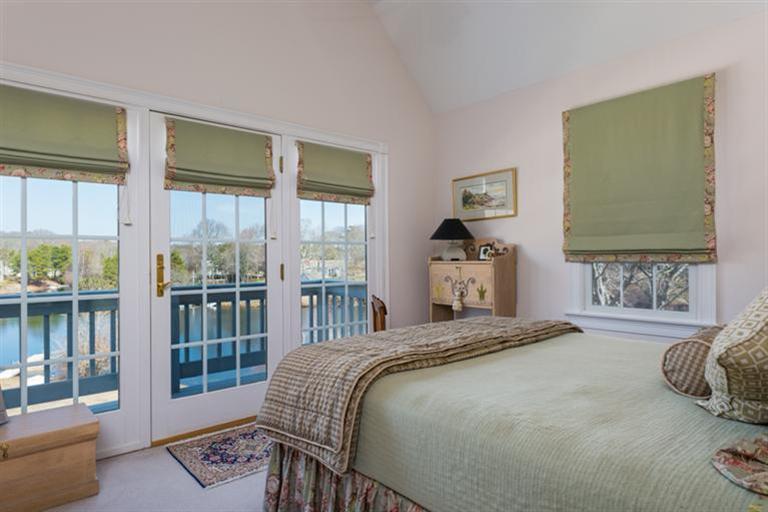 113 James Circle Mashpee, MA 02649 - Photo 18 of 21 a bedroom with a large bed and a window