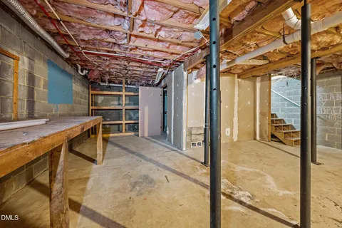 a view of a porch with a table and chairs