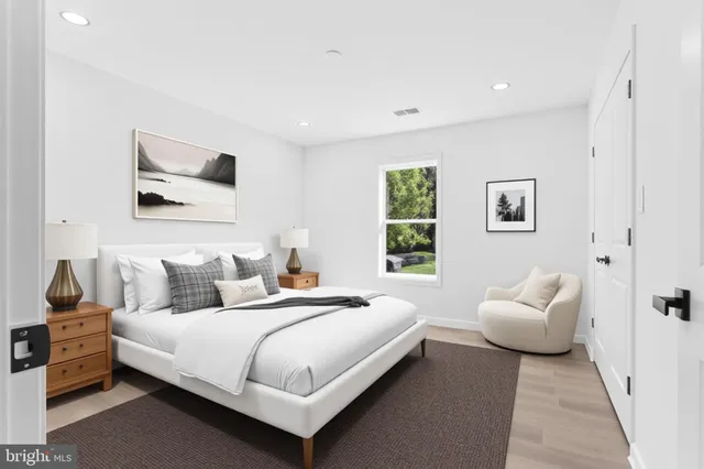 a bathroom with a sink toilet vanity and shower