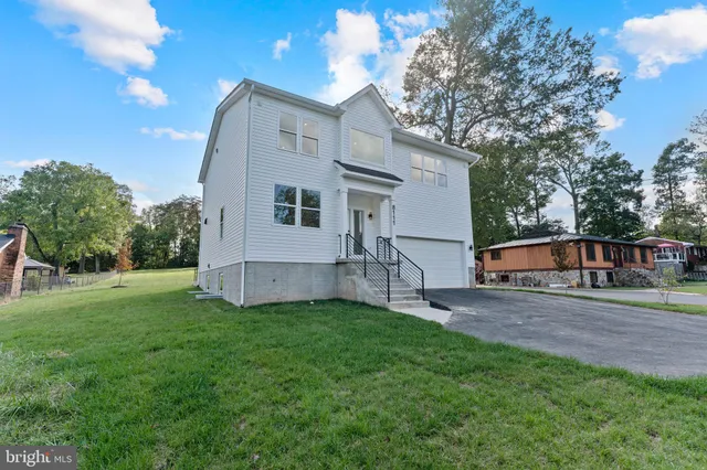 a kitchen with stainless steel appliances kitchen island a refrigerator and a stove top oven